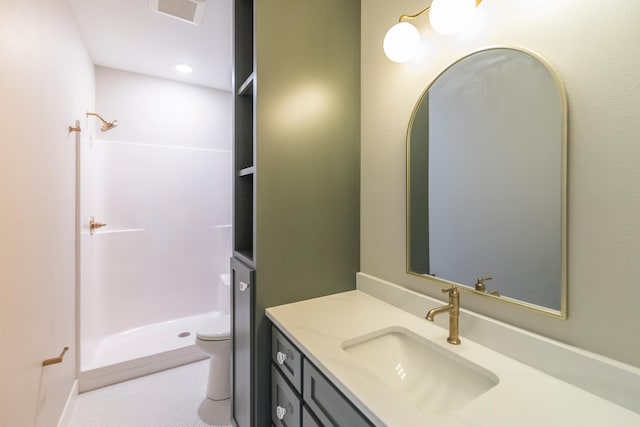 29655 E Horseshoe Lake Rd, Mission Twp, MN 56465 - bathroom featuring a stall shower, toilet, vanity, and tile patterned flooring