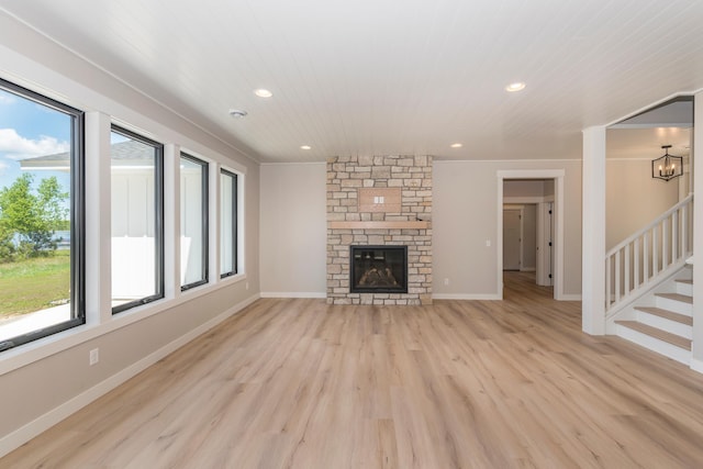 29655 E Horseshoe Lake Rd, Mission Twp, MN 56465 - unfurnished living room featuring light wood-style flooring, stairway, recessed lighting, and a fireplace