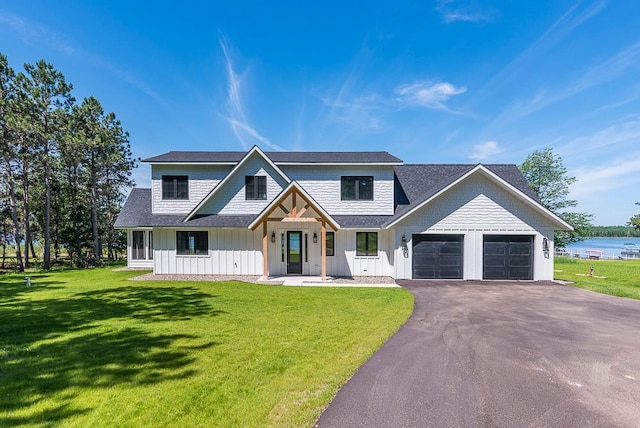 29655 E Horseshoe Lake Rd, Mission Twp, MN 56465 - modern farmhouse with an attached garage, board and batten siding, driveway, and a front lawn