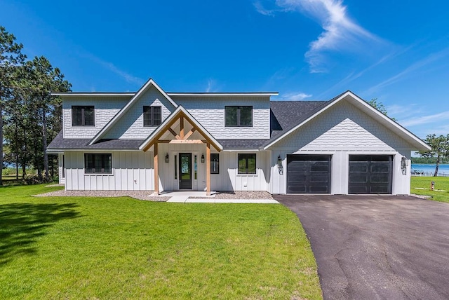 29655 E Horseshoe Lake Rd, Mission Twp, MN 56465 - modern farmhouse style home with an attached garage, board and batten siding, driveway, and a front yard