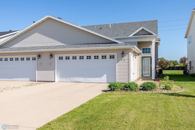 828 Cinnamon Ridge Pl, West Fargo, ND 58078 - traditional-style home with concrete driveway, a front lawn, an attached garage, and a shingled roof