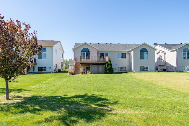 828 Cinnamon Ridge Pl, West Fargo, ND 58078 - rear view of property featuring a lawn and a wooden deck