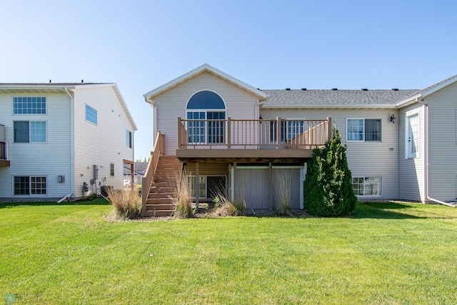 828 Cinnamon Ridge Pl, West Fargo, ND 58078 - rear view of house with a deck, stairs, and a yard