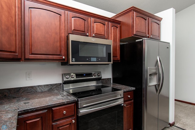 828 Cinnamon Ridge Pl, West Fargo, ND 58078 - kitchen featuring appliances with stainless steel finishes, carpet flooring, and baseboards