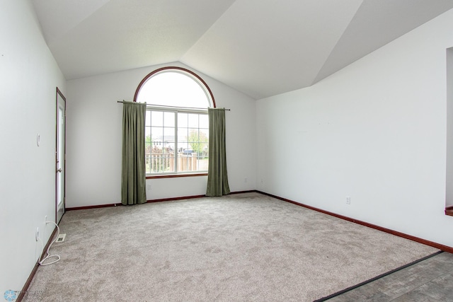 828 Cinnamon Ridge Pl, West Fargo, ND 58078 - unfurnished room with vaulted ceiling, baseboards, and carpet flooring
