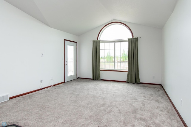 828 Cinnamon Ridge Pl, West Fargo, ND 58078 - spare room with lofted ceiling, carpet flooring, and baseboards