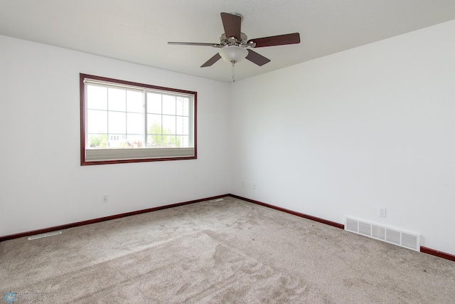 828 Cinnamon Ridge Pl, West Fargo, ND 58078 - unfurnished room with carpet floors, a ceiling fan, and baseboards
