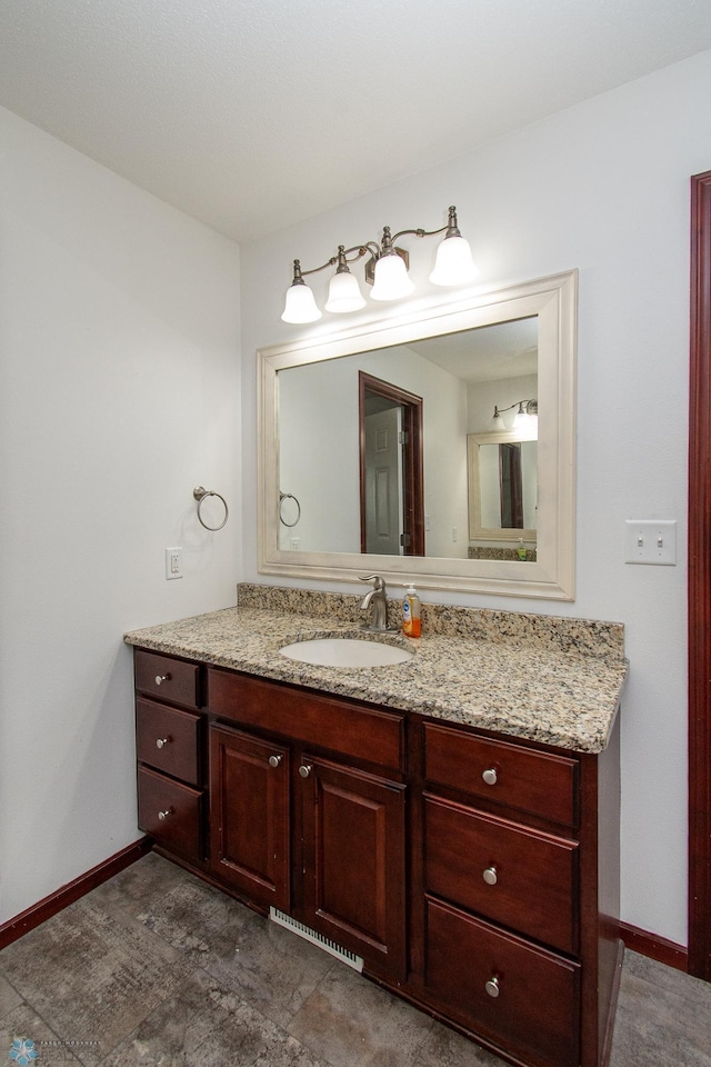 828 Cinnamon Ridge Pl, West Fargo, ND 58078 - bathroom featuring baseboards and vanity