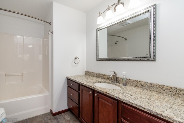 828 Cinnamon Ridge Pl, West Fargo, ND 58078 - full bath featuring vanity, toilet, bathing tub / shower combination, and wood finished floors