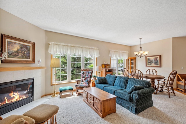 17830 Glasgow Way, Lakeville, MN 55044 - living area featuring light colored carpet, a chandelier, a fireplace, and a textured ceiling
