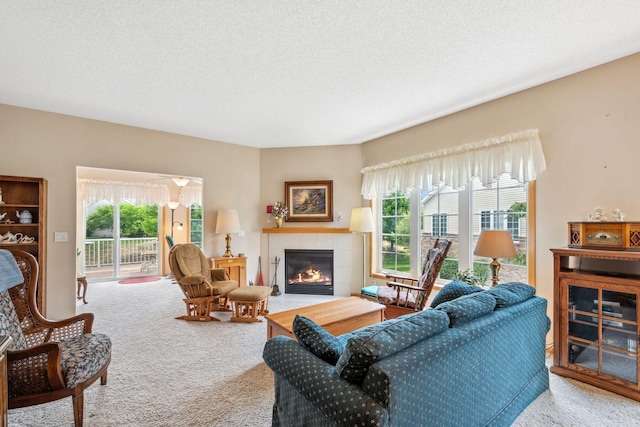 17830 Glasgow Way, Lakeville, MN 55044 - living room with carpet, a tile fireplace, and a textured ceiling