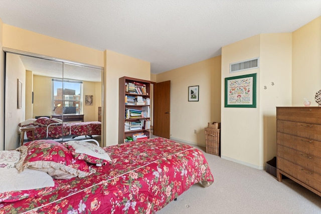 1425 28th St Unit 510, Minneapolis, MN 55408 - bedroom featuring carpet flooring, a closet, and baseboards