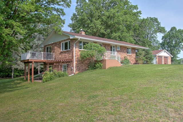 2509 Jade St, Mora, MN 55051 - back of house featuring brick siding, a chimney, a lawn, and a wooden deck