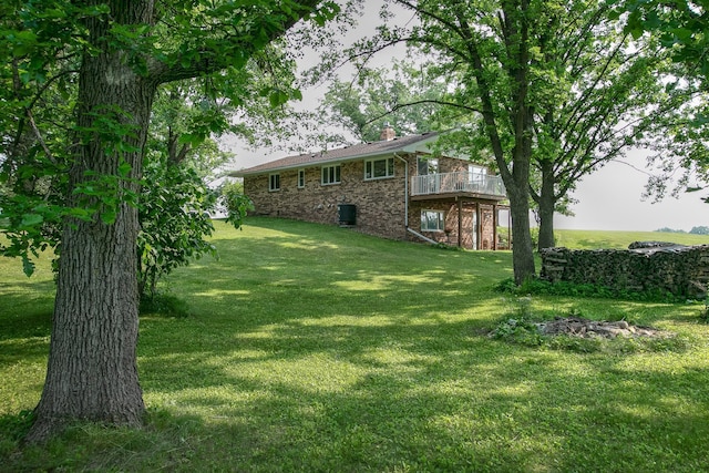 2509 Jade St, Mora, MN 55051 - view of grassy yard with a wooden deck