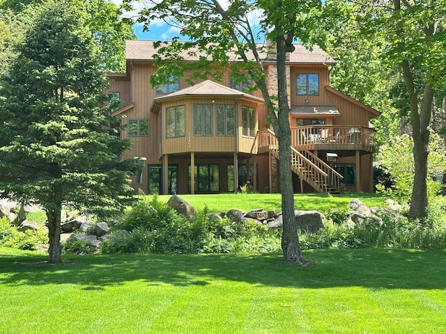 18819 329th Ave, Isle, MN 56342 - rear view of house featuring a deck, stairs, and a yard