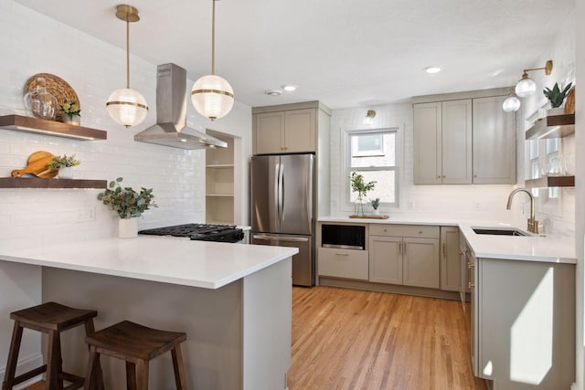 2930 Salem Ave, Saint Louis Park, MN 55416 - kitchen with freestanding refrigerator, ventilation hood, a sink, open shelves, and gray cabinets
