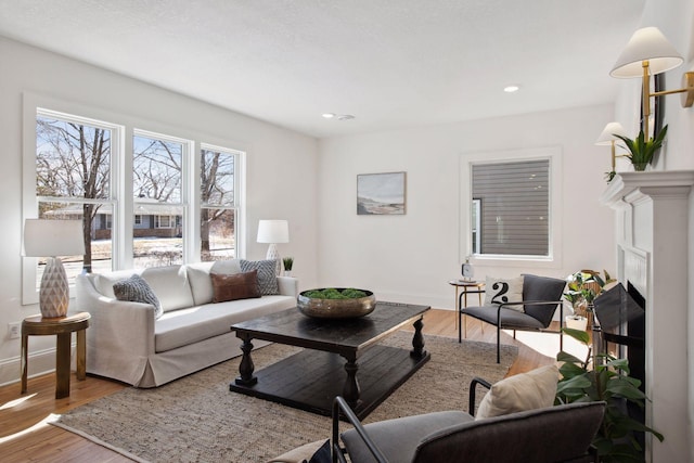 2930 Salem Ave, Saint Louis Park, MN 55416 - living room with wood finished floors, a fireplace, baseboards, and recessed lighting