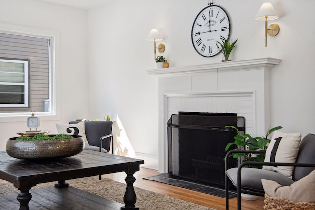 2930 Salem Ave, Saint Louis Park, MN 55416 - living room featuring a brick fireplace and wood finished floors