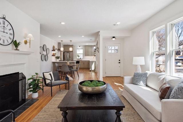 2930 Salem Ave, Saint Louis Park, MN 55416 - living area featuring light wood-type flooring, a tile fireplace, and recessed lighting