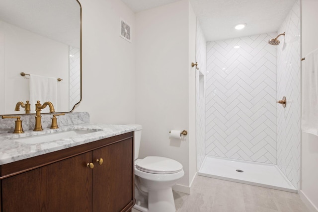 2930 Salem Ave, Saint Louis Park, MN 55416 - full bath with vanity, baseboards, tiled shower, and toilet