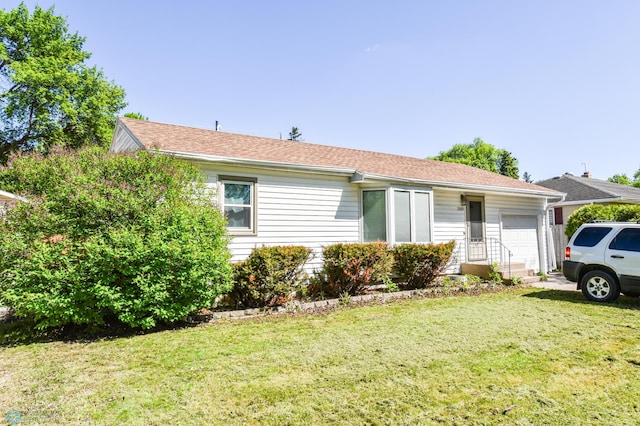 2009 7th St N, Fargo, ND 58102 - single story home with a front yard and an attached garage