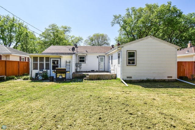 2009 7th St N, Fargo, ND 58102 - back of house featuring a sunroom and a deck