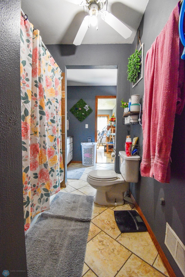 2009 7th St N, Fargo, ND 58102 - full bath featuring toilet, a ceiling fan, and a shower with shower curtain
