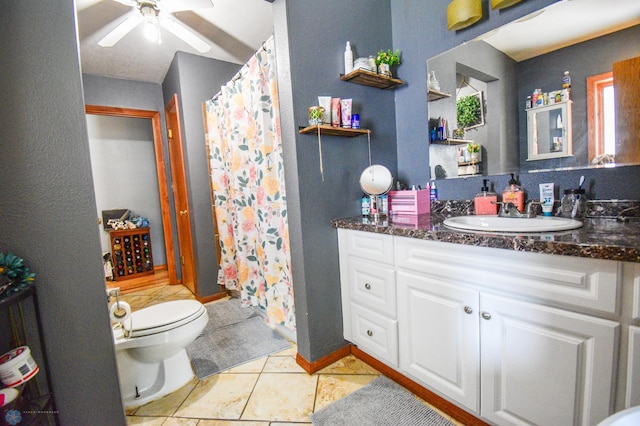 2009 7th St N, Fargo, ND 58102 - full bathroom featuring vanity, toilet, ceiling fan, tile patterned flooring, and a shower with curtain