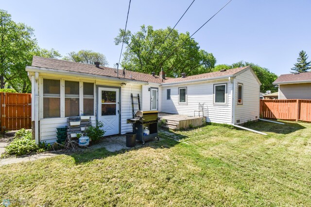 2009 7th St N, Fargo, ND 58102 - back of house with a wooden deck and a shingled roof