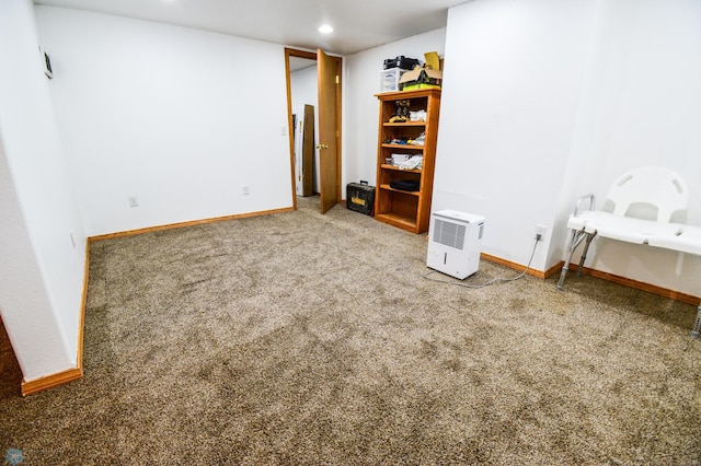 2009 7th St N, Fargo, ND 58102 - carpeted empty room with baseboards and recessed lighting