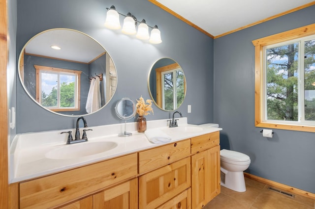 2487 2nd St SW, Buffalo, MN 55313 - full bathroom featuring double vanity, toilet, plenty of natural light, ornamental molding, and tile patterned floors