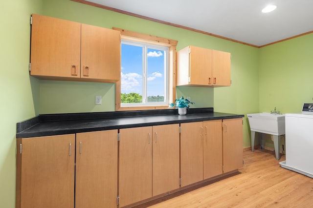 2487 2nd St SW, Buffalo, MN 55313 - laundry room with washer / dryer, light wood-style floors, ornamental molding, cabinet space, and recessed lighting