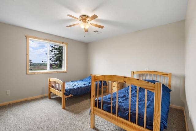 2487 2nd St SW, Buffalo, MN 55313 - bedroom featuring carpet flooring, baseboards, and a ceiling fan