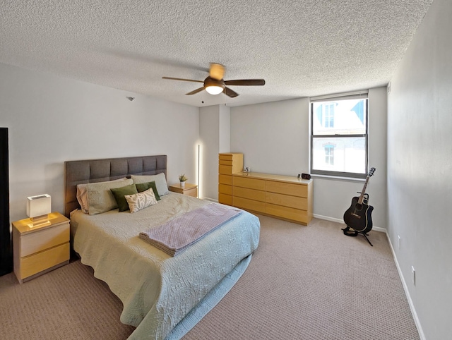 401 1st St Unit 601, Minneapolis, MN 55401 - bedroom with light colored carpet, ceiling fan, a textured ceiling, and baseboards