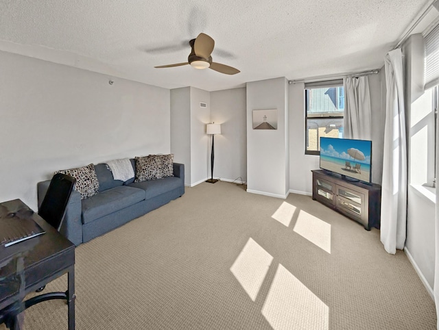 401 1st St Unit 601, Minneapolis, MN 55401 - carpeted living room with a textured ceiling, a ceiling fan, and baseboards
