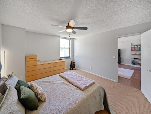 401 1st St Unit 601, Minneapolis, MN 55401 - carpeted bedroom with a ceiling fan, a textured ceiling, and baseboards