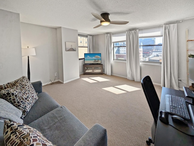 401 1st St Unit 601, Minneapolis, MN 55401 - living area featuring a ceiling fan, plenty of natural light, carpet floors, a textured ceiling, and baseboards