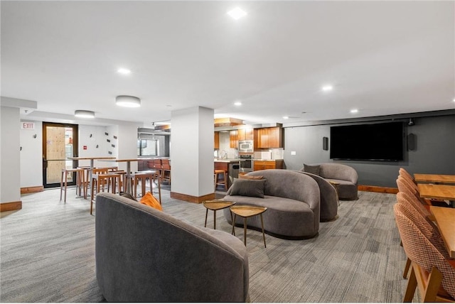 401 1st St Unit 601, Minneapolis, MN 55401 - living room featuring baseboards, light carpet, and recessed lighting