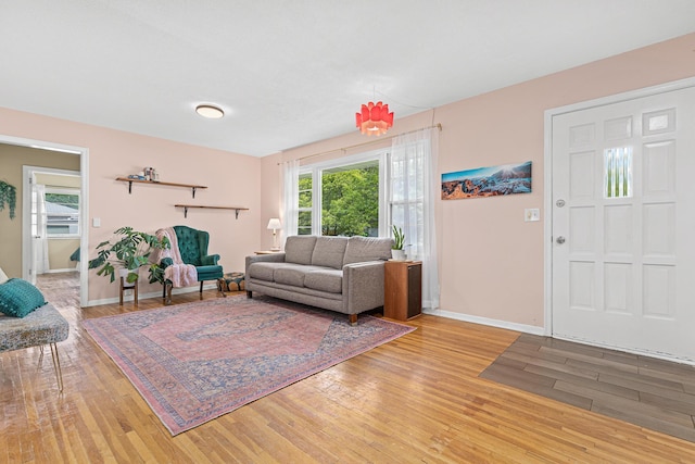 7109 Douglas Dr N, Brooklyn Park, MN 55429 - living room with light wood-style flooring, plenty of natural light, and baseboards
