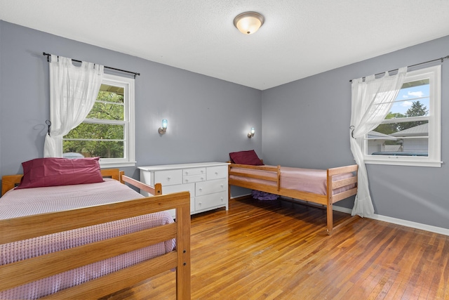 7109 Douglas Dr N, Brooklyn Park, MN 55429 - bedroom featuring light wood finished floors and baseboards