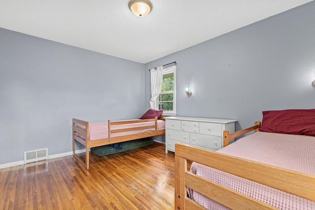 7109 Douglas Dr N, Brooklyn Park, MN 55429 - bedroom with wood finished floors and baseboards