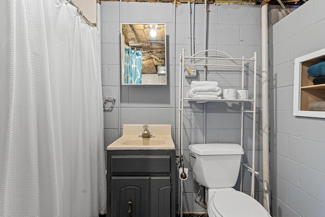 7109 Douglas Dr N, Brooklyn Park, MN 55429 - full bath with vanity, toilet, and concrete block wall