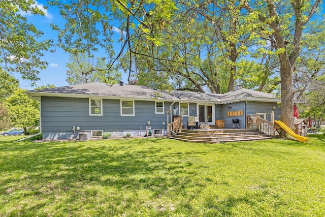 7109 Douglas Dr N, Brooklyn Park, MN 55429 - rear view of property with a yard and a wooden deck