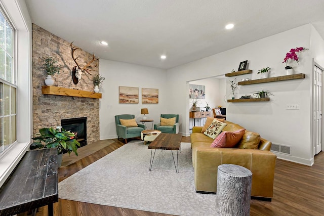 15084 Appaloosa Trl NE, Prior Lake, MN 55372 - living area featuring a stone fireplace, wood finished floors, baseboards, and recessed lighting