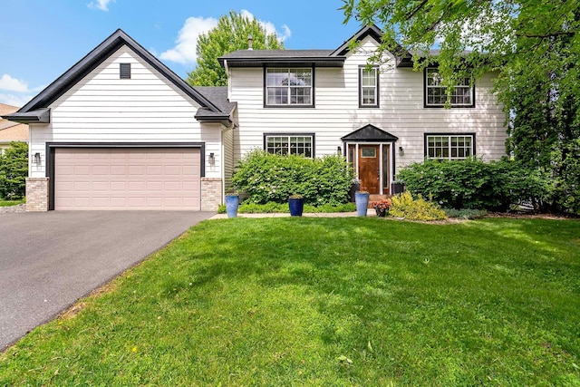 15084 Appaloosa Trl NE, Prior Lake, MN 55372 - view of front facade featuring asphalt driveway, a front yard, and an attached garage