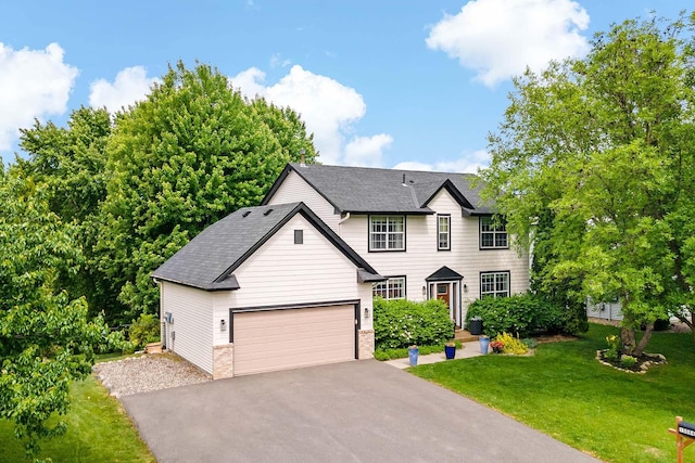 15084 Appaloosa Trl NE, Prior Lake, MN 55372 - traditional home featuring asphalt driveway, a front yard, a shingled roof, and an attached garage