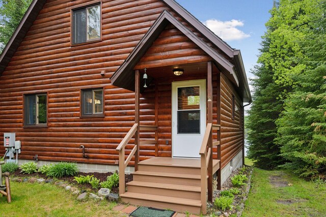 7194 Quentin Rd NE, Outing, MN 56662 - view of front of house with log veneer siding