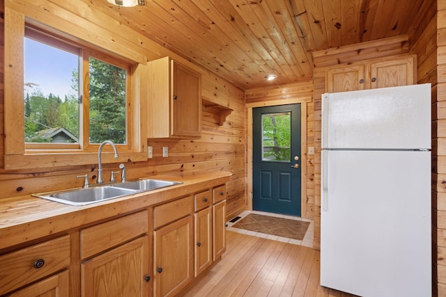 7194 Quentin Rd NE, Outing, MN 56662 - kitchen with freestanding refrigerator, wooden counters, a sink, wood ceiling, and light wood finished floors