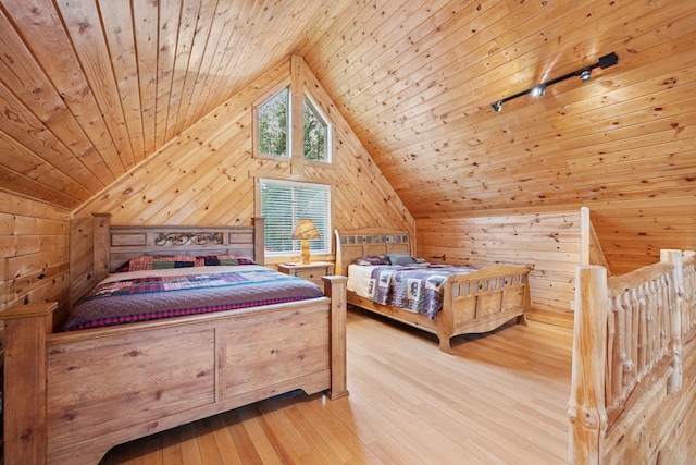 7194 Quentin Rd NE, Outing, MN 56662 - bedroom with wooden walls, vaulted ceiling, wood ceiling, and hardwood / wood-style flooring