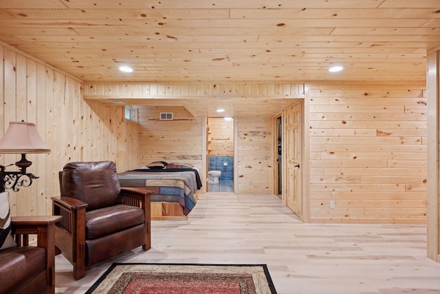7194 Quentin Rd NE, Outing, MN 56662 - bedroom with wooden walls, wooden ceiling, wood finished floors, and ensuite bath